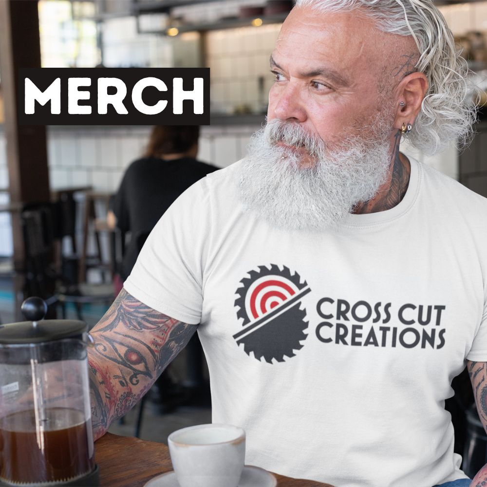 Man wearing a white Cross Cut Creations T Shirt